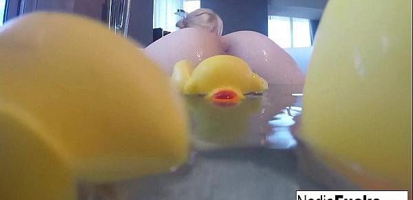  Nadia takes a bath with some rubber duckies